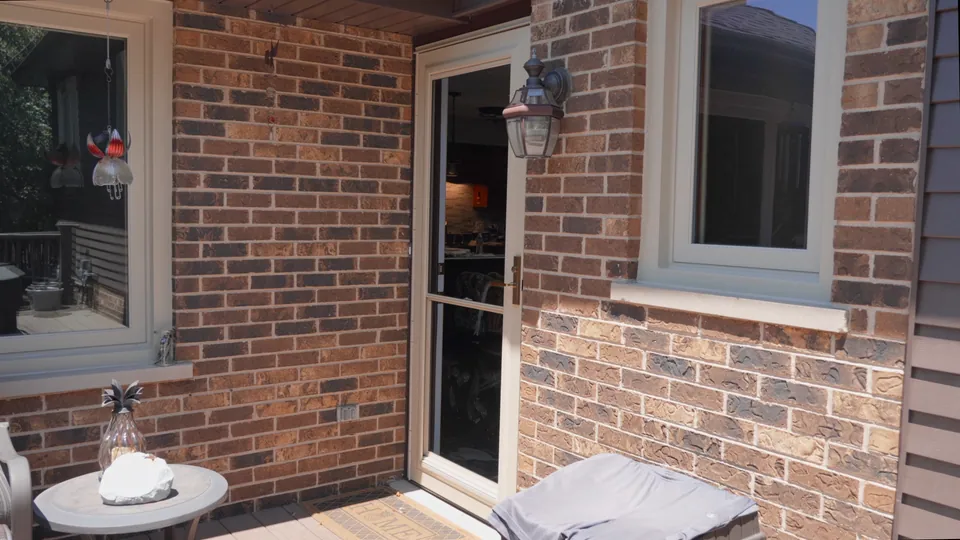 A new full-view glass storm door on a brick Chicagoland south-suburb home — an Excel install