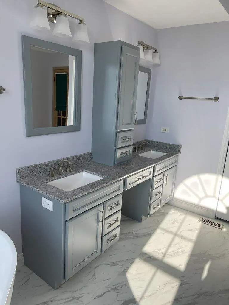 Gray double vanity with a center storage tower and granite top, Chicagoland