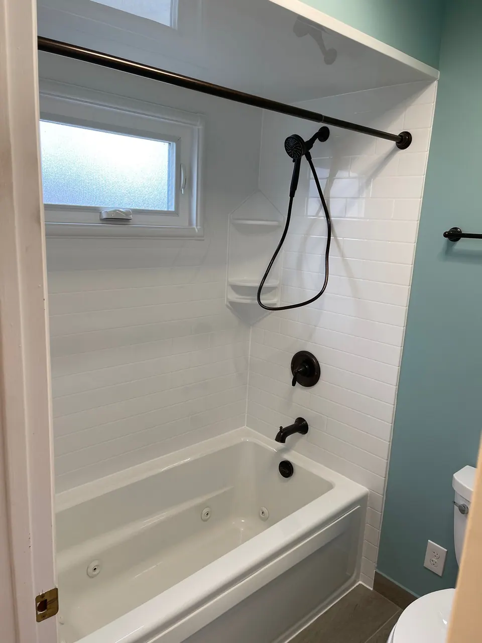 Finished tub and shower with a solid-surface surround, an Excel install in Chicagoland's south suburbs