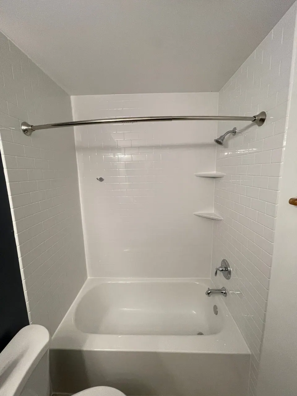 White solid-surface walk-in shower, an Excel install