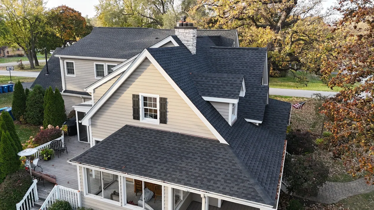 New architectural-shingle roof with a full tear-off on a wraparound-porch home, Chicagoland