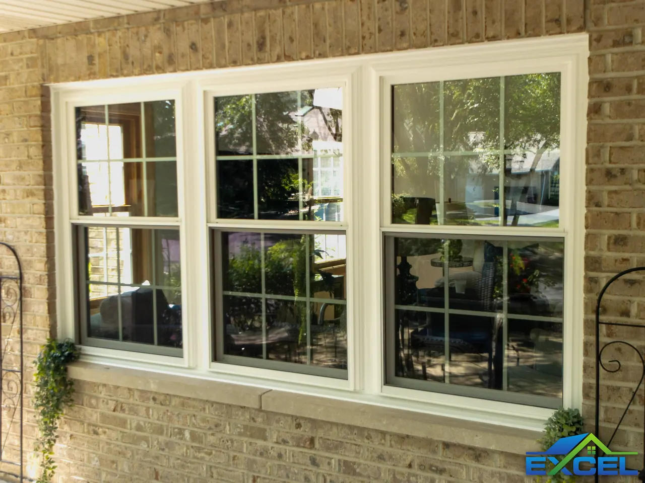 Triple double-hung window in a brick wall