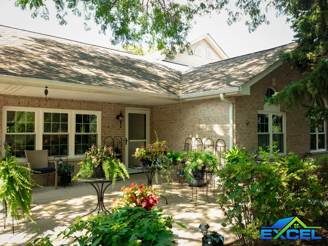 Brick home courtyard with replacement windows