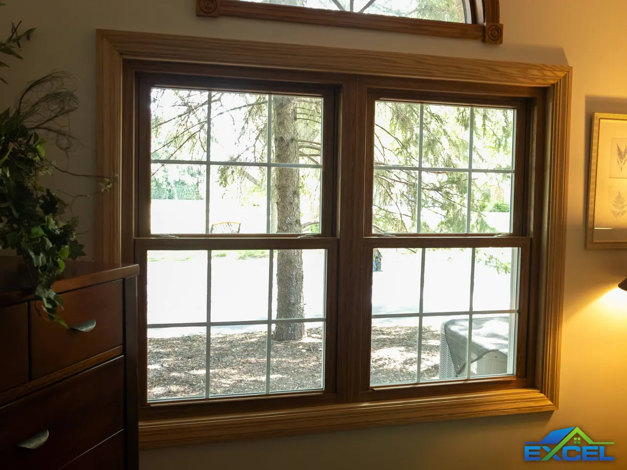 Pair of oak-trimmed double-hung windows