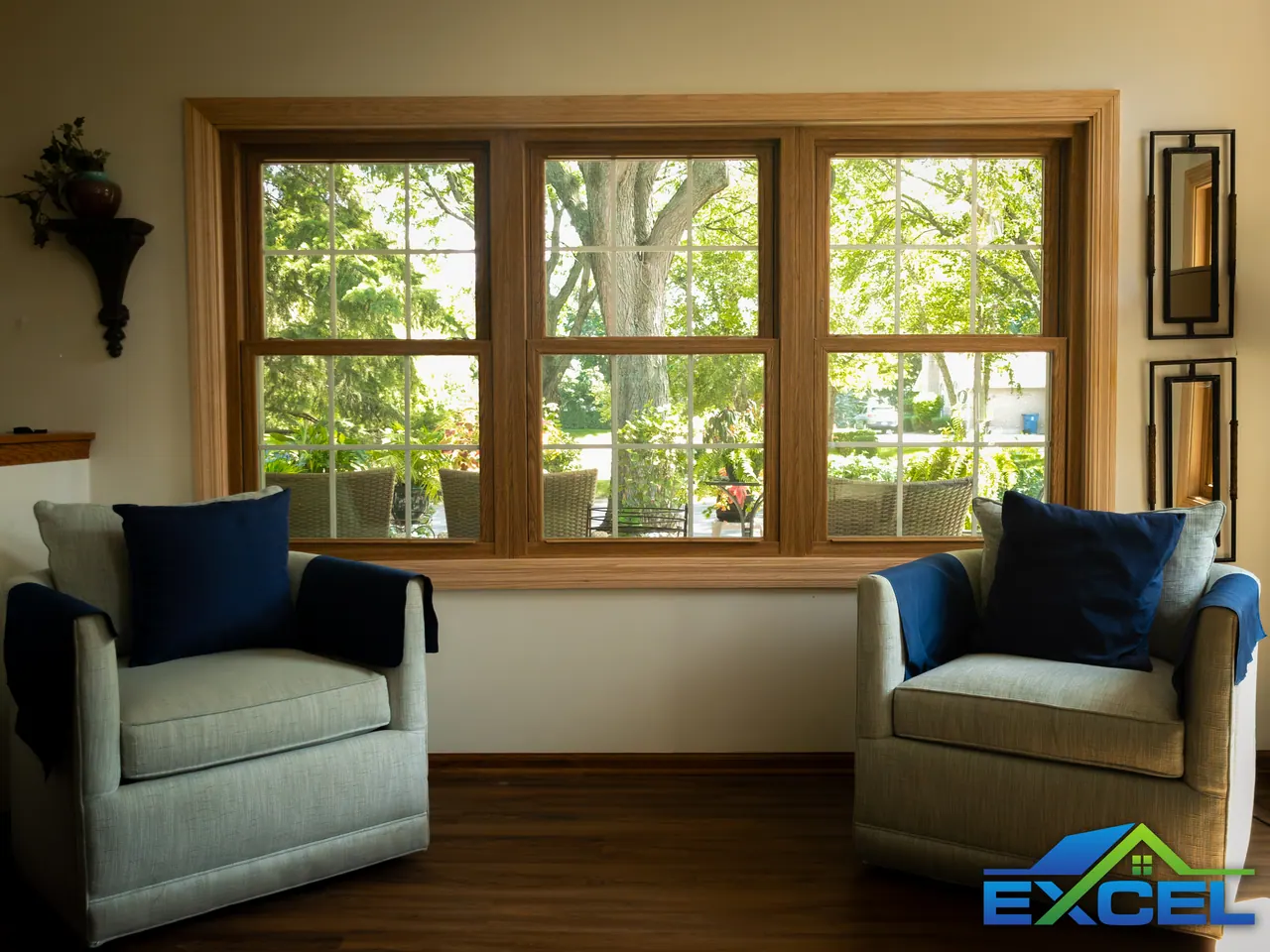 Three oak-trimmed double-hung replacement windows in a living room