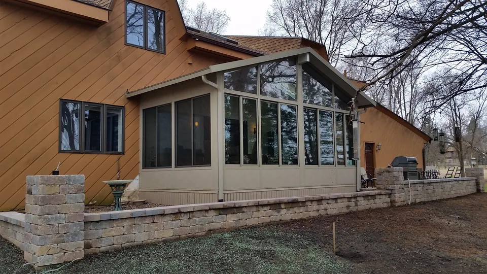 Four-season sunroom glass wall on a Chicagoland home — an Excel install