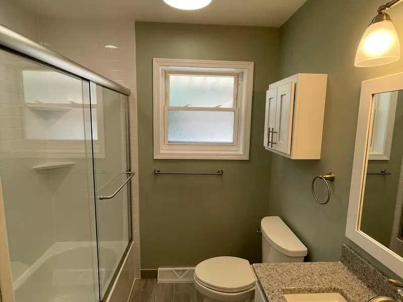 Finished full bathroom remodel with a glass walk-in shower and a window, an Excel install in the south suburbs